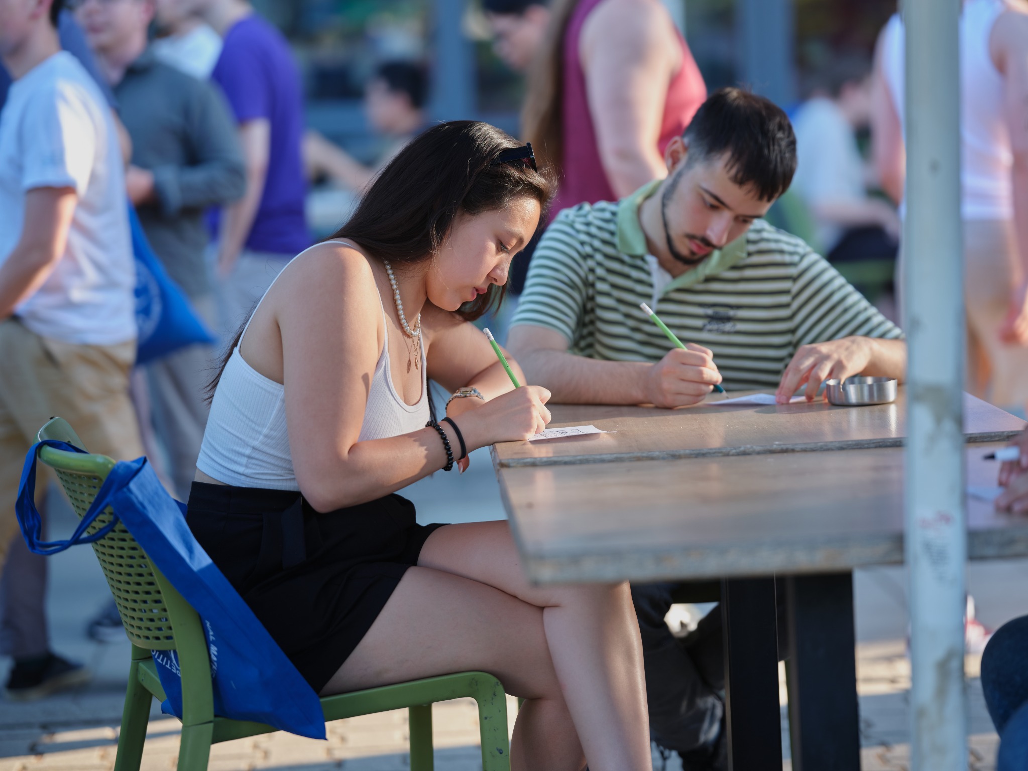 IMC participants working on mathematics outdoors